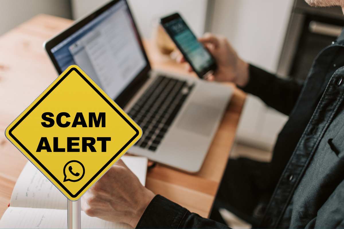 WhatsApp su pc e smartphone e cartello allerta truffa
